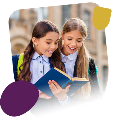 2 school girls reading a school book